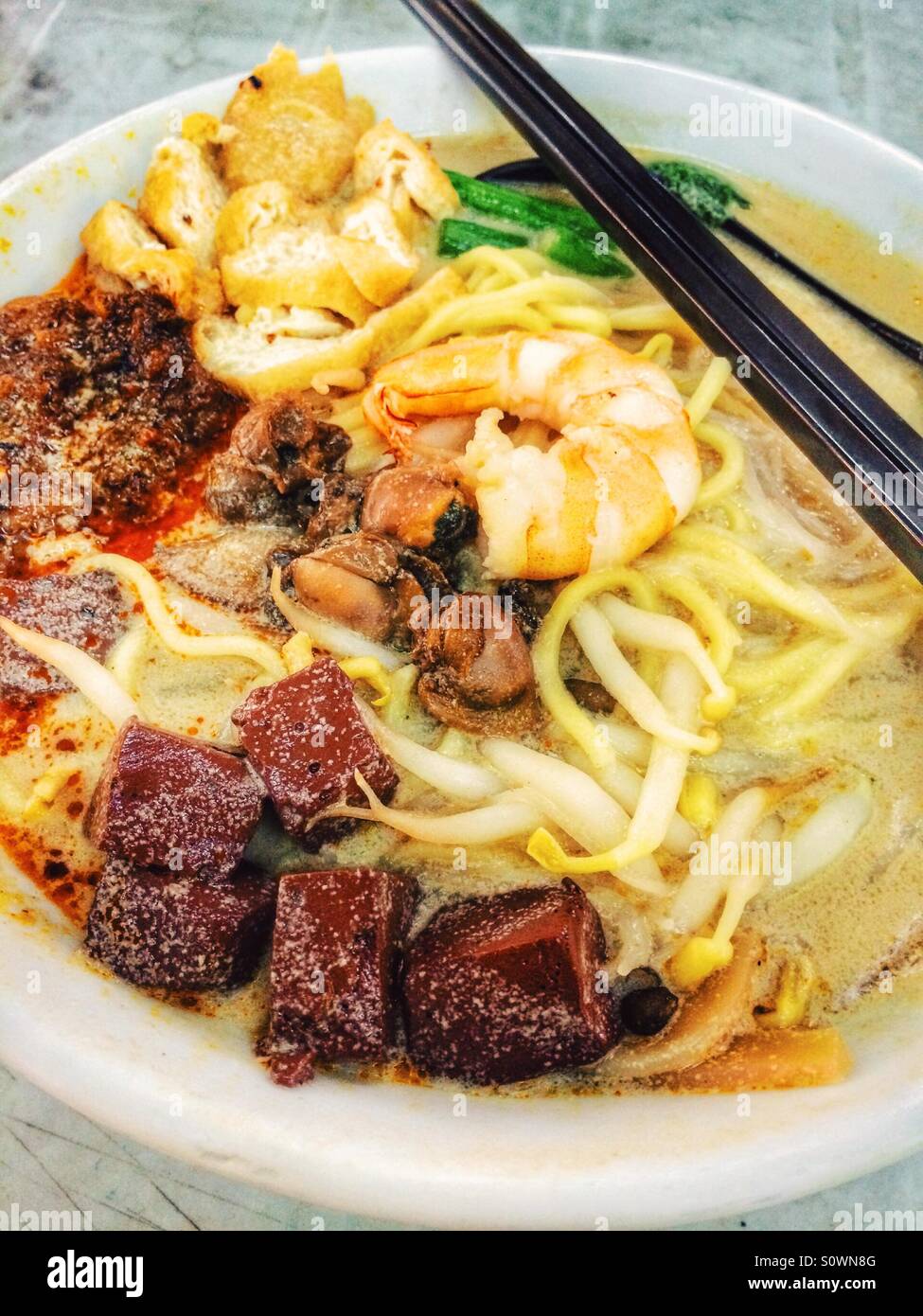 Malaysian Penang white curry noodle soup - Smartphone Captured Stock Image