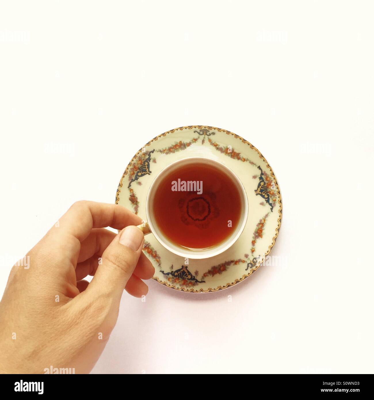 A tiny cup of tea Stock Photo