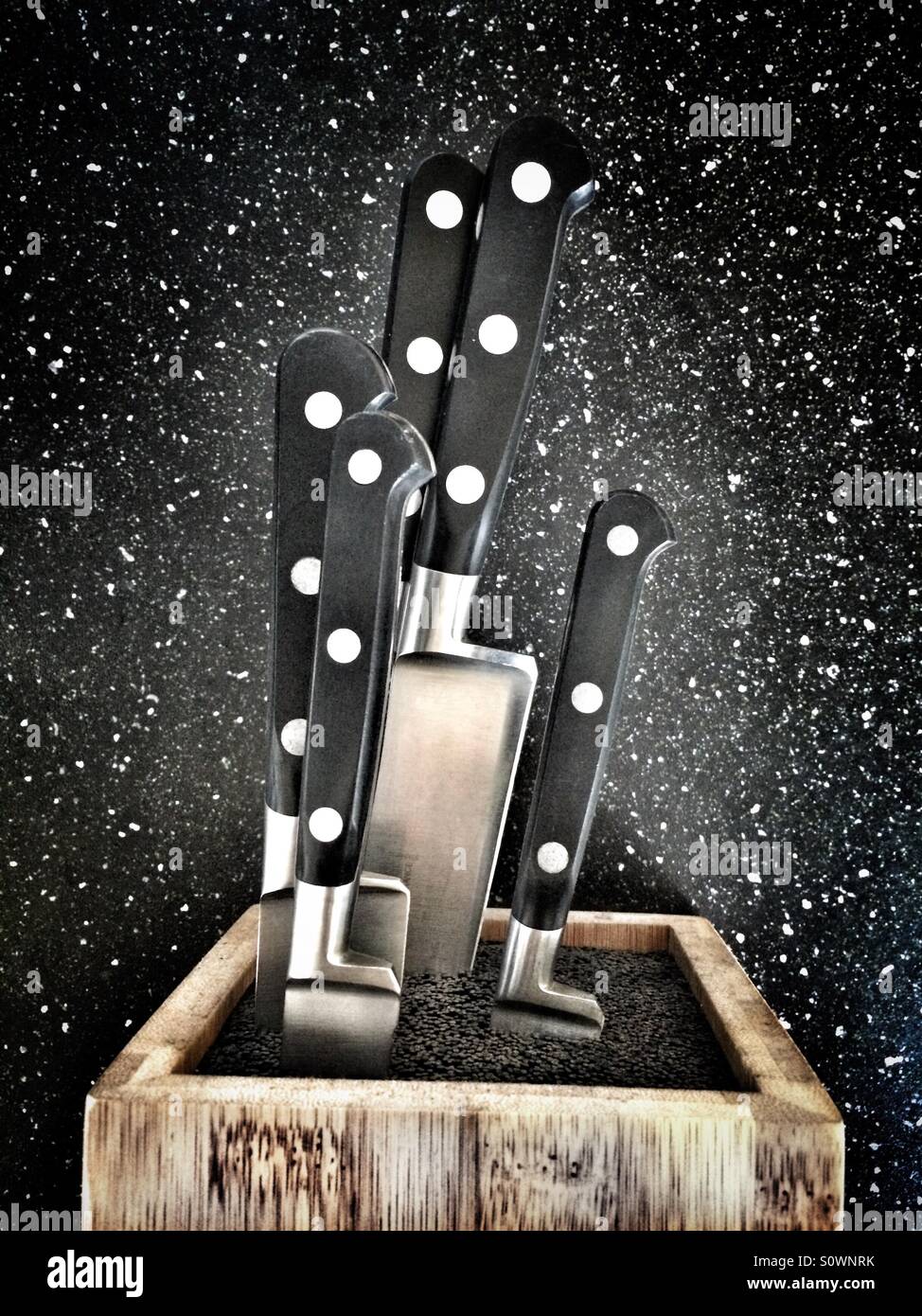 Kitchen knives in a knife block Stock Photo Alamy