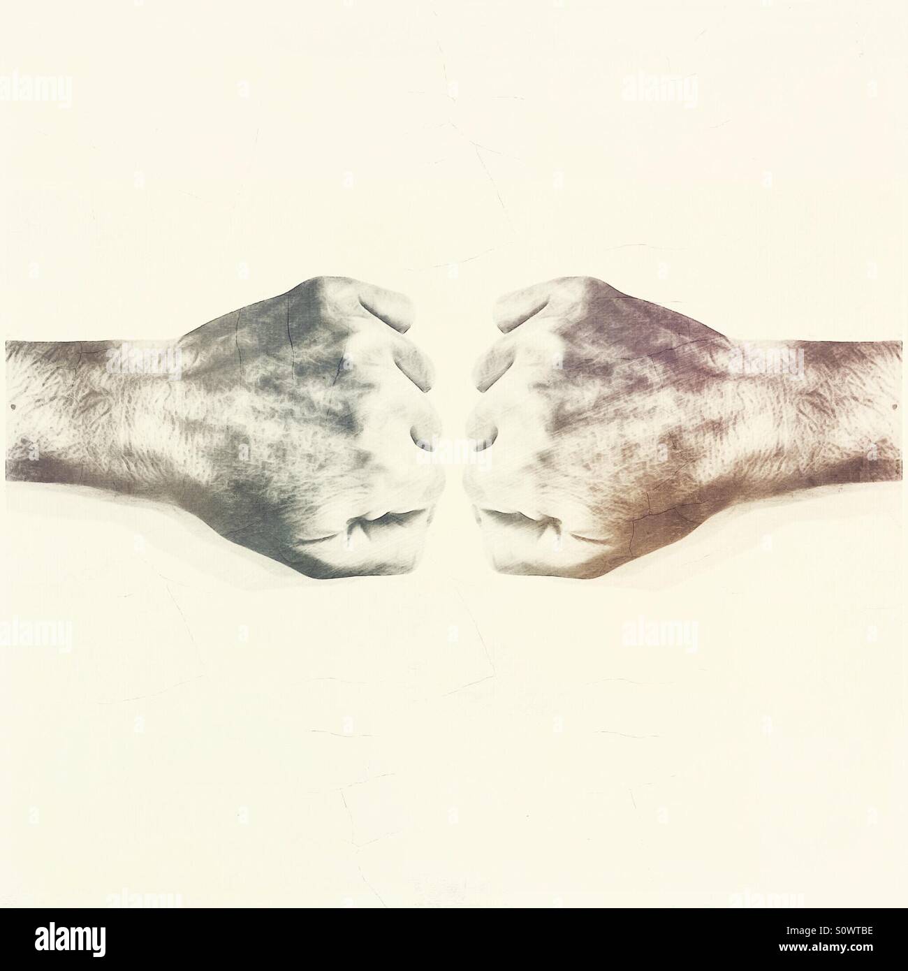 2 hands clenched into fists - Smartphone Captured Stock Image