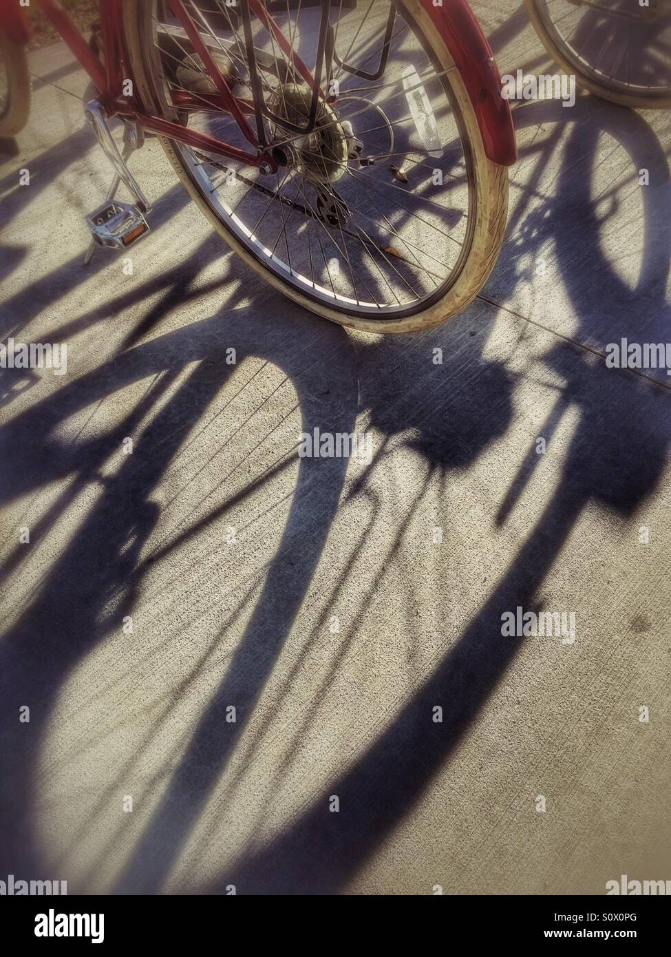 Red Bicycles with shadows - Smartphone Captured Stock Image