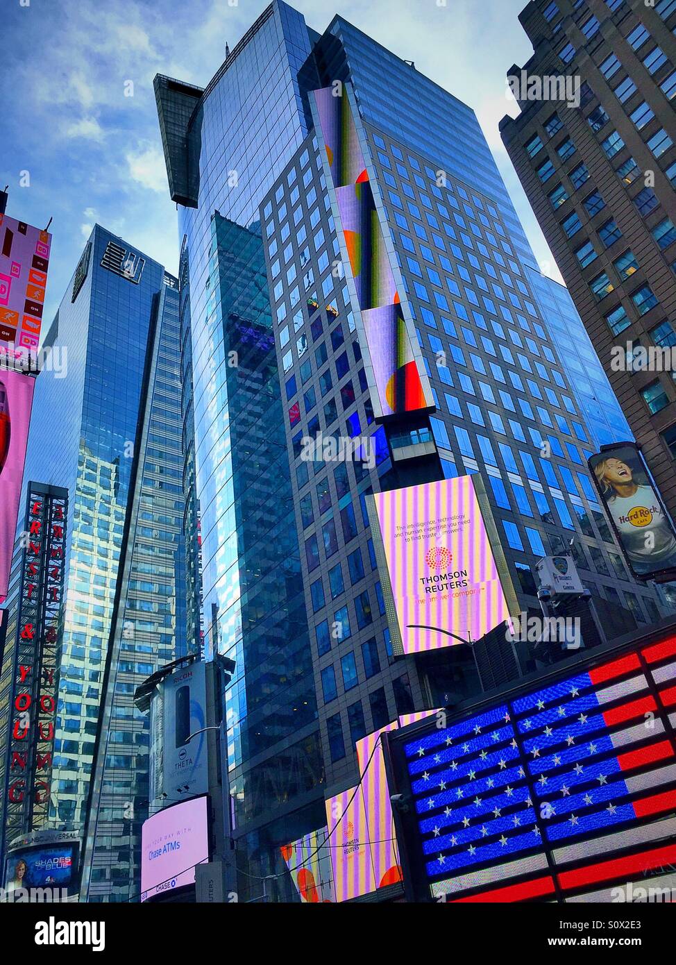 The Reuters building is covered in electronic billboards at the corner of 42nd St. and seventh Avenue in times square NYC - Smartphone Captured Stock Image