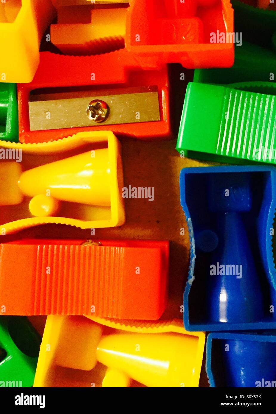 Lots of coloured pencil sharpeners Stock Photo