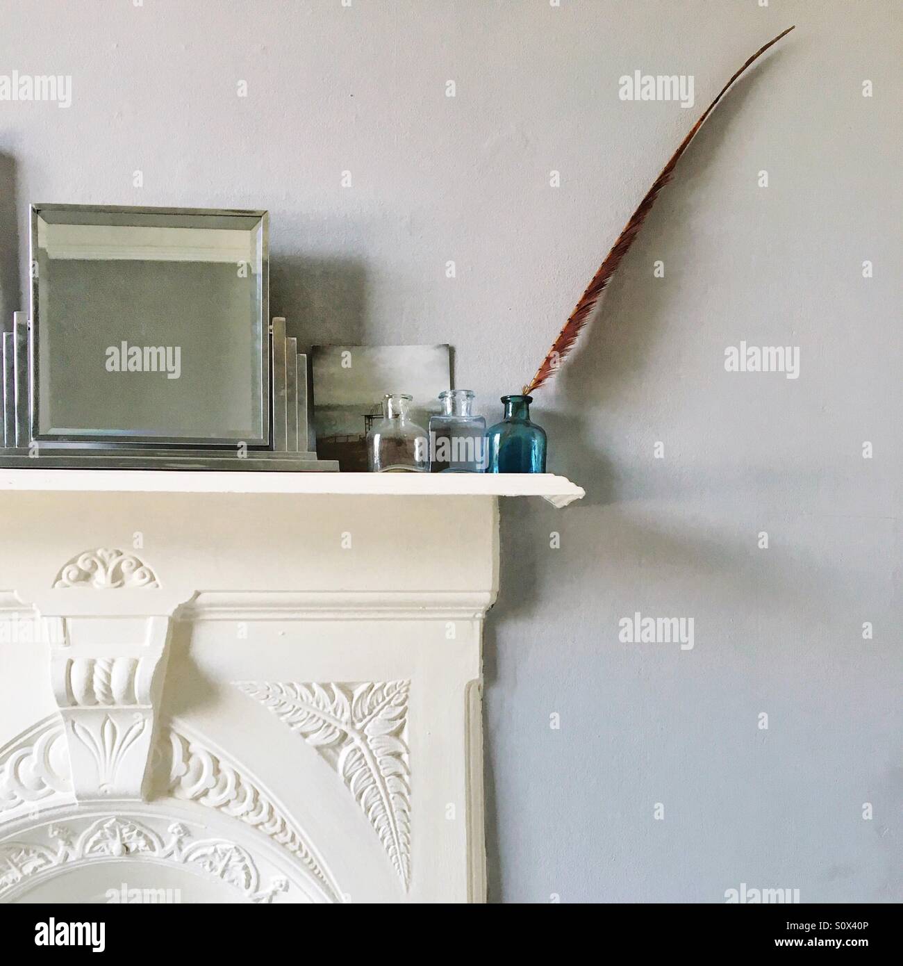 Fireplace with mirror and ornaments - Smartphone Captured Stock Image