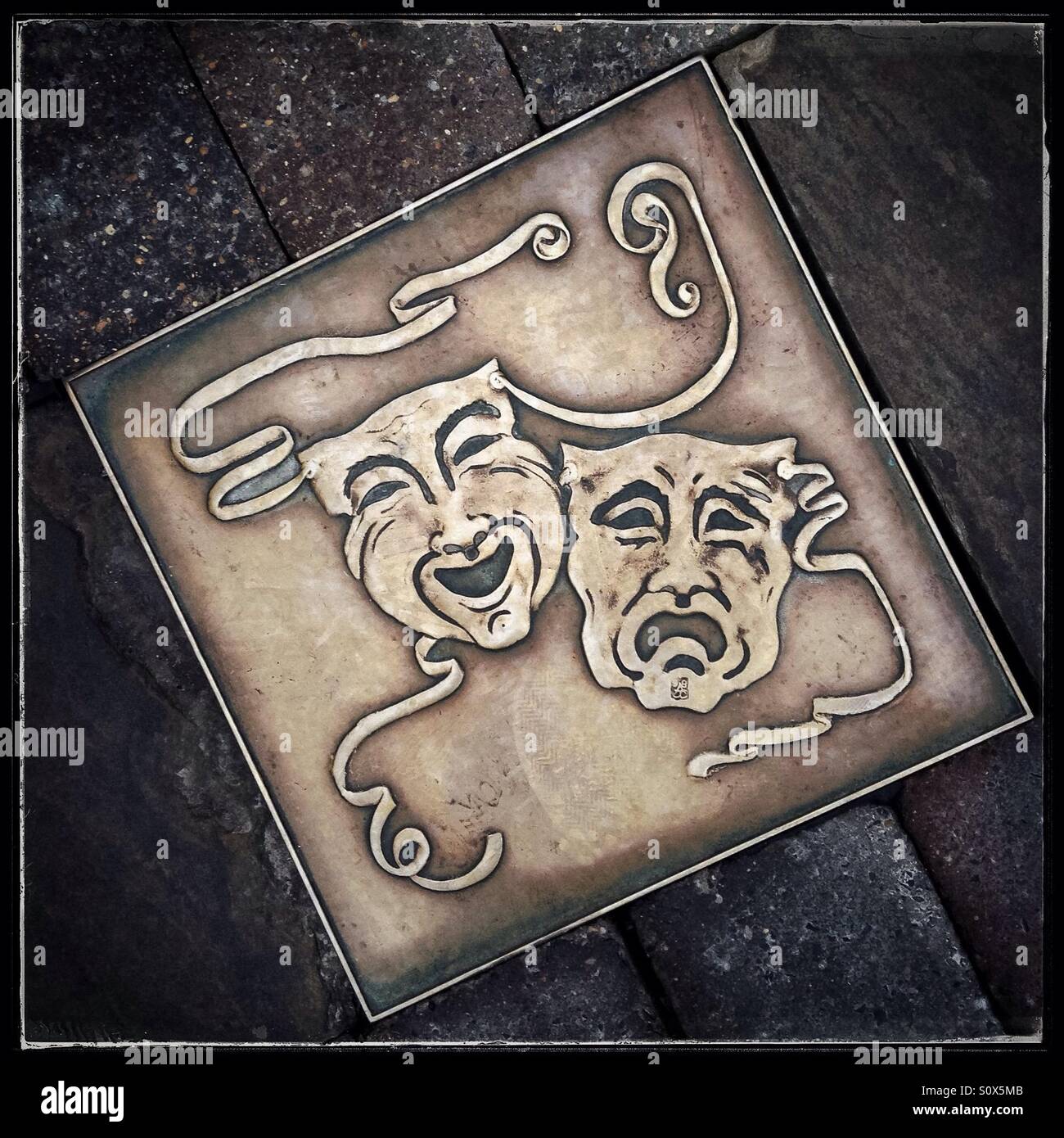 Theatre brass plaque on the street, Harrogate, UK. - Smartphone Captured Stock Image