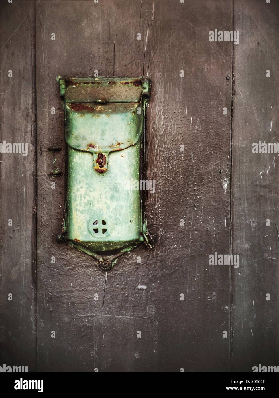 Old pale green wall mounted mailbox - Smartphone Captured Stock Image