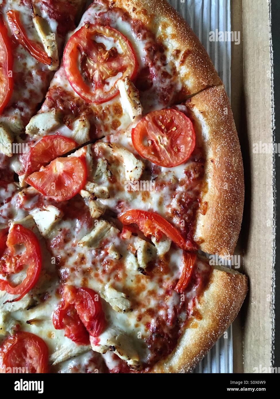 Chicken and tomato pizza Stock Photo