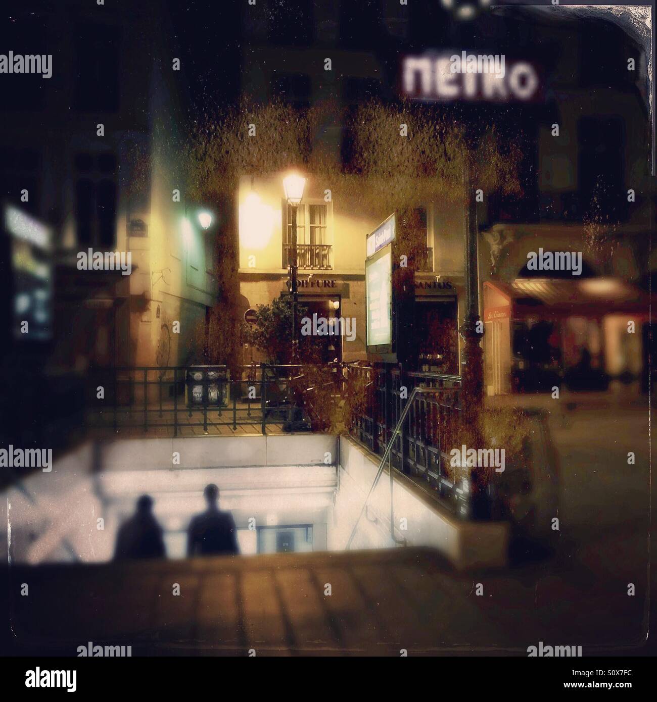 Entrance to a Paris metro station at night. - Smartphone Captured Stock Image