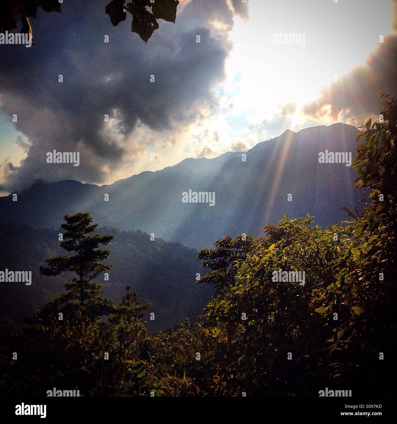 The Sun shines over the Cerro del Venado mountain in El Triunfo Biosphere Reserve, Chiapas, Mexico Stock Photo