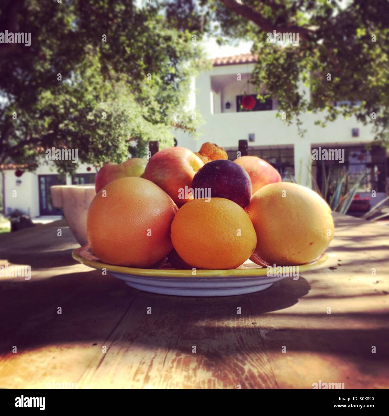 Bowl of fruit on outside table. - Smartphone Captured Stock Image