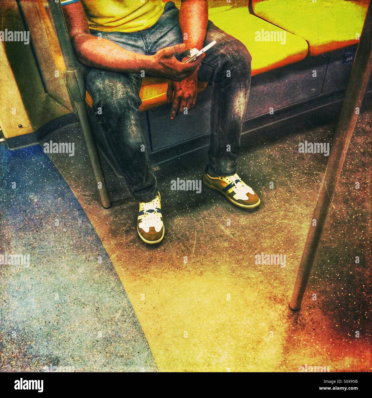 Man using mobile phone on BTS Skytrain, Bangkok, Thailand - Smartphone Captured Stock Image