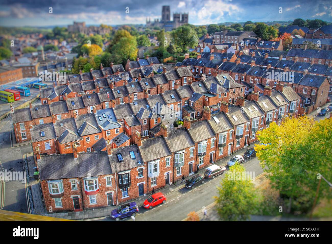 Looking down onto rows of terraced houses in the city of Durham. Durham Cathedral as a backdrop to old fashioned terrace houses. - Smartphone Captured Stock Image