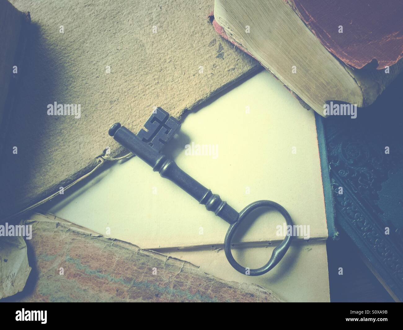 Old key on vintage book pages - Smartphone Captured Stock Image