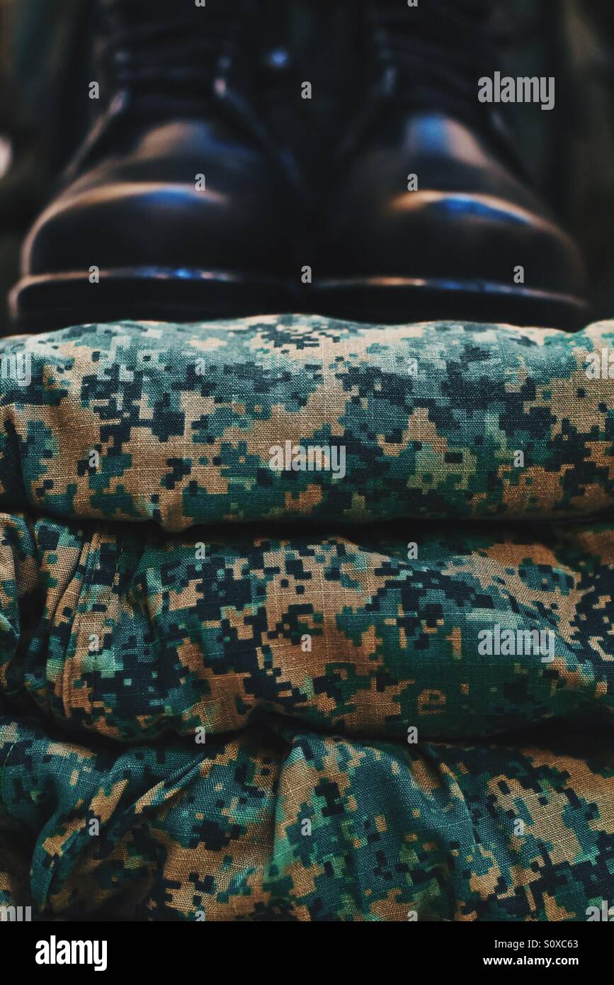 Army boots and uniform Stock Photo Alamy