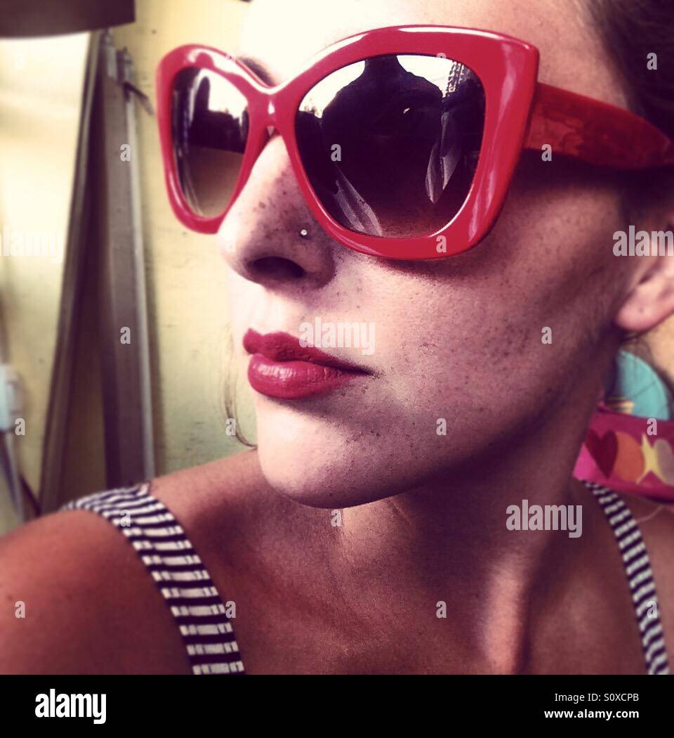 Red lipstick, red sunglasses and stripped dress Stock Photo Alamy