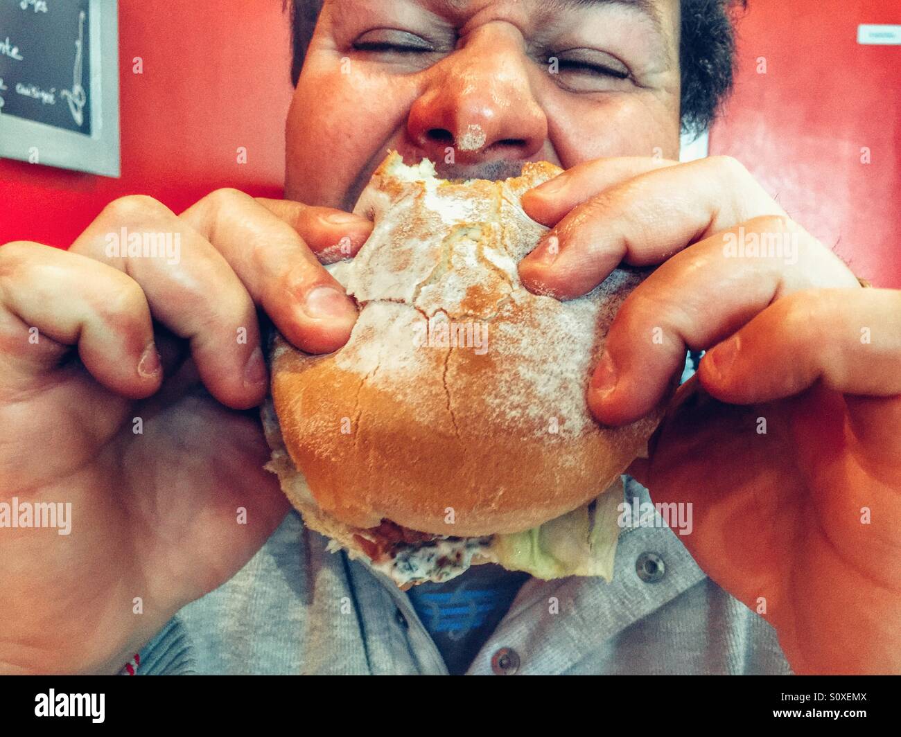 Man eating burger Stock Photo