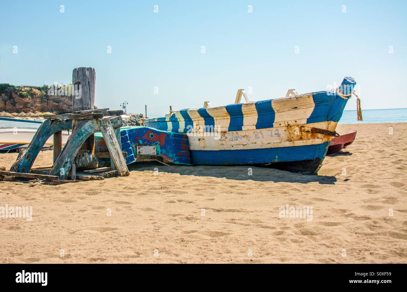 Small fishing boat wreck on the beach - Smartphone Captured Stock Image