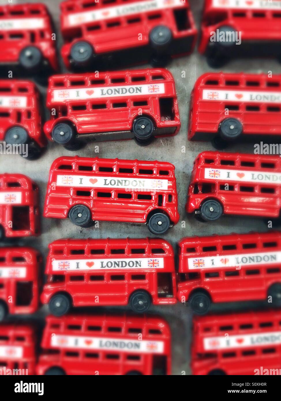 Red busses sold as souvenirs in Camden Town, London, UK Stock Photo