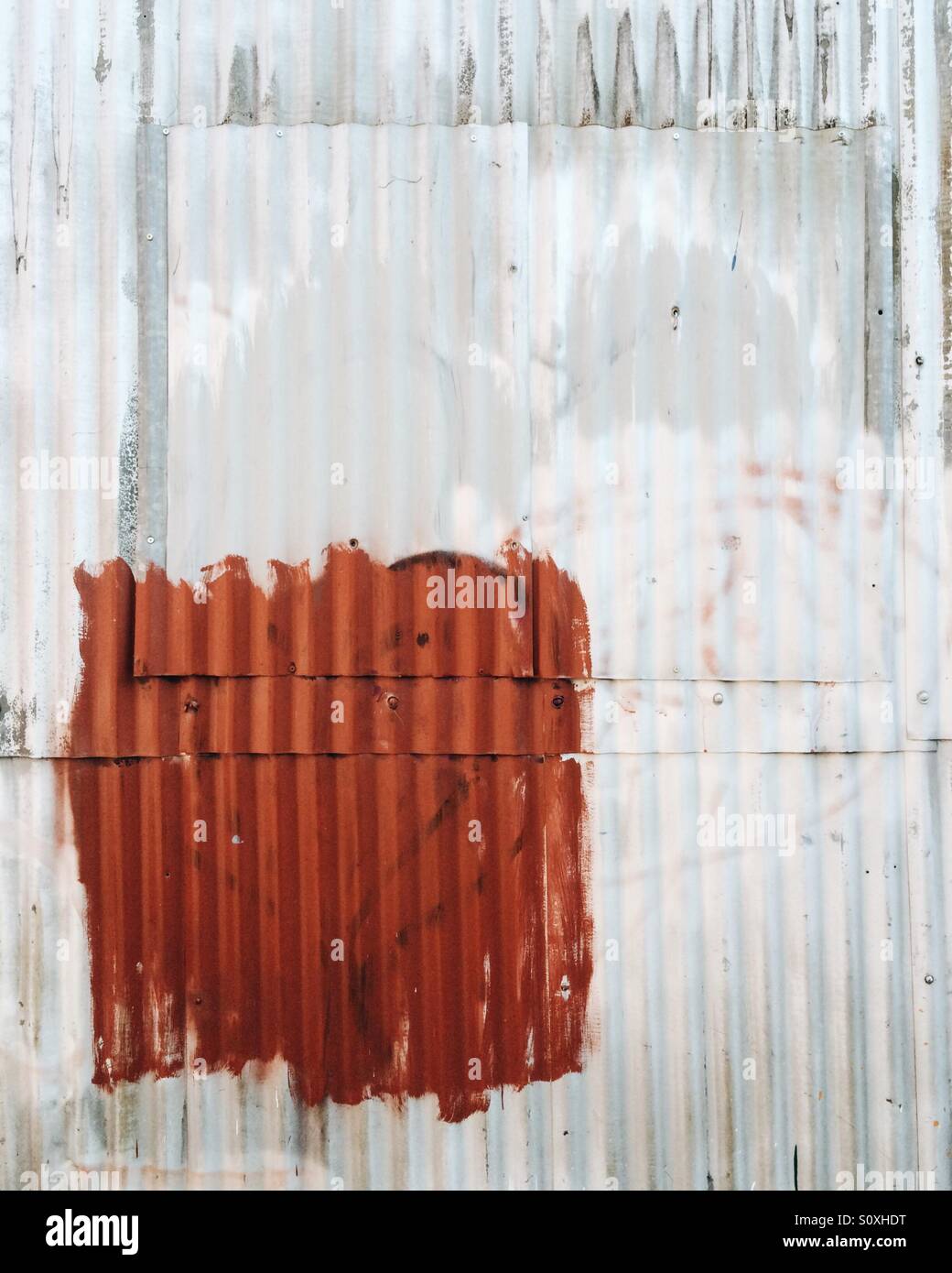 Abstract corrugated iron on the side of an industrial building in Burlington, Vermont. Stock Photo
