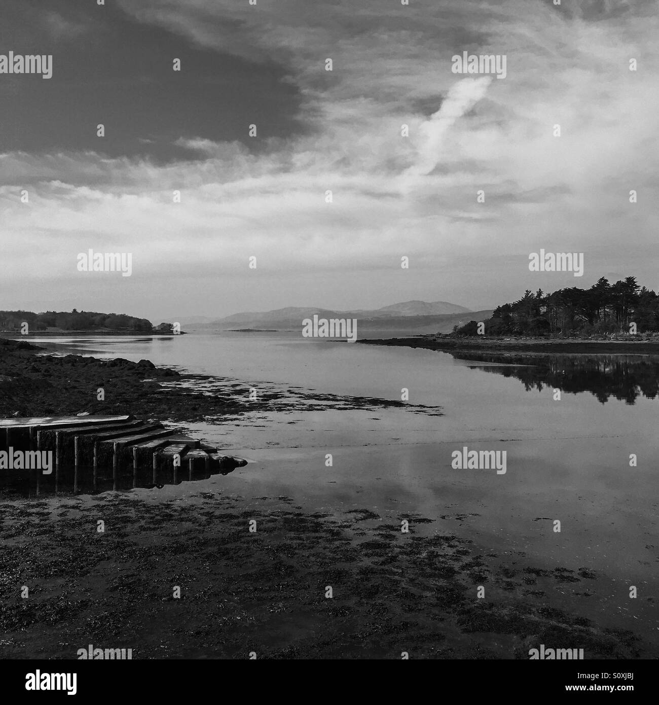 Lake view with mountains in the distance Stock Photo Alamy