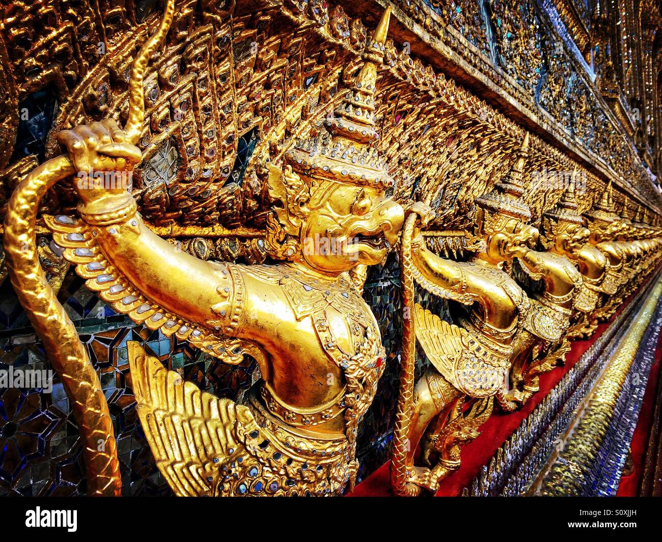 Row of figurines at the Grand Palace, Bangkok, Thailand - Smartphone Captured Stock Image