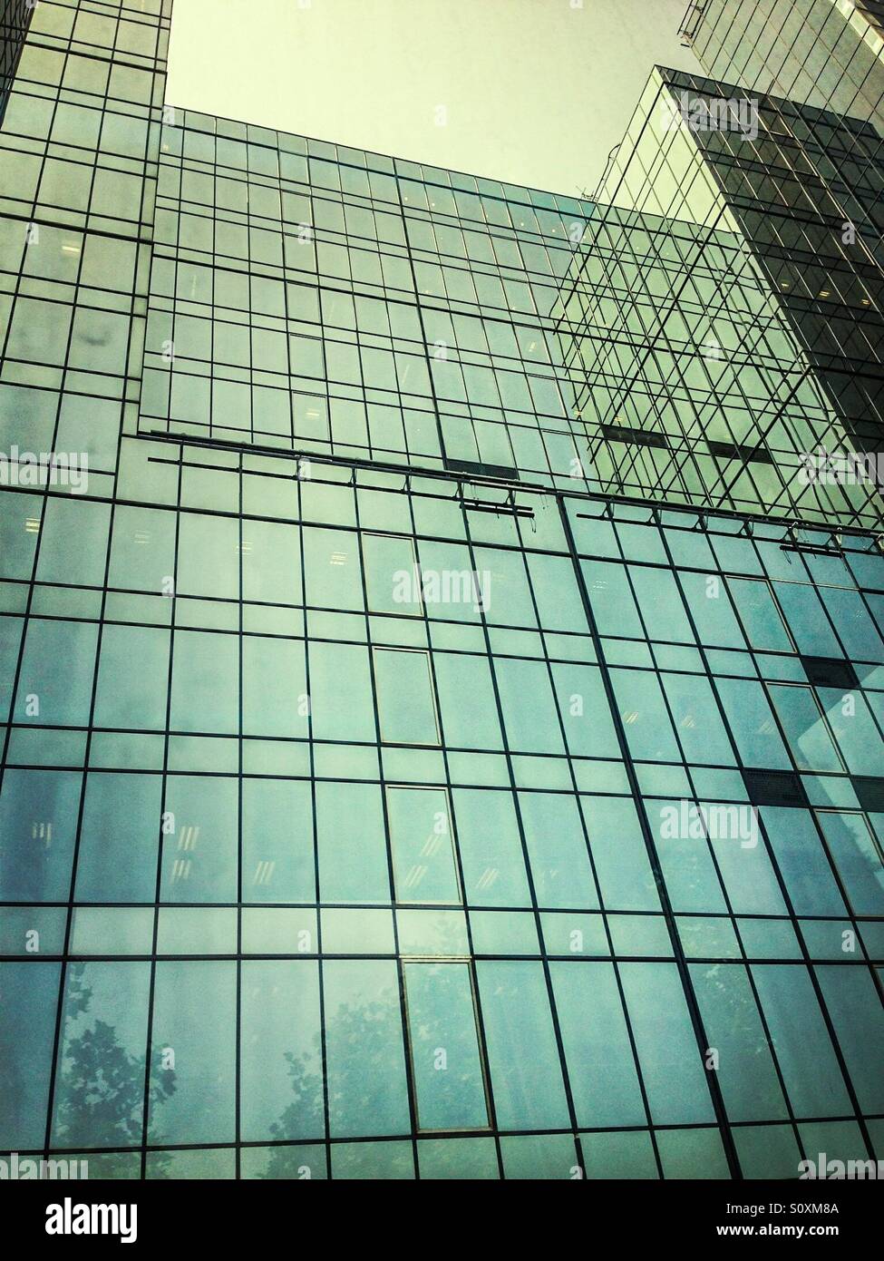 Low angle view of glass building - Smartphone Captured Stock Image