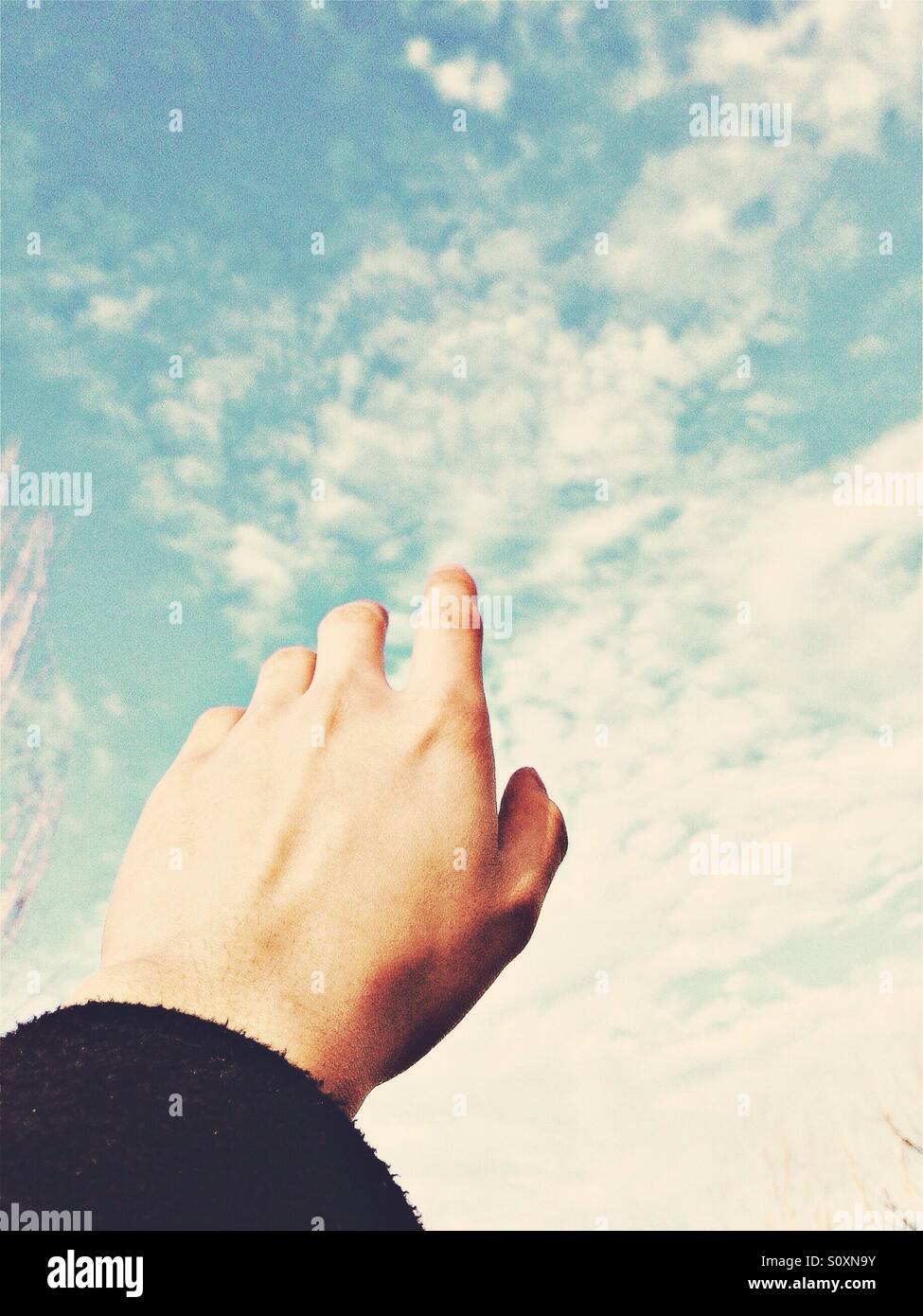 Boy raise hand sky hi-res stock photography and images - Alamy