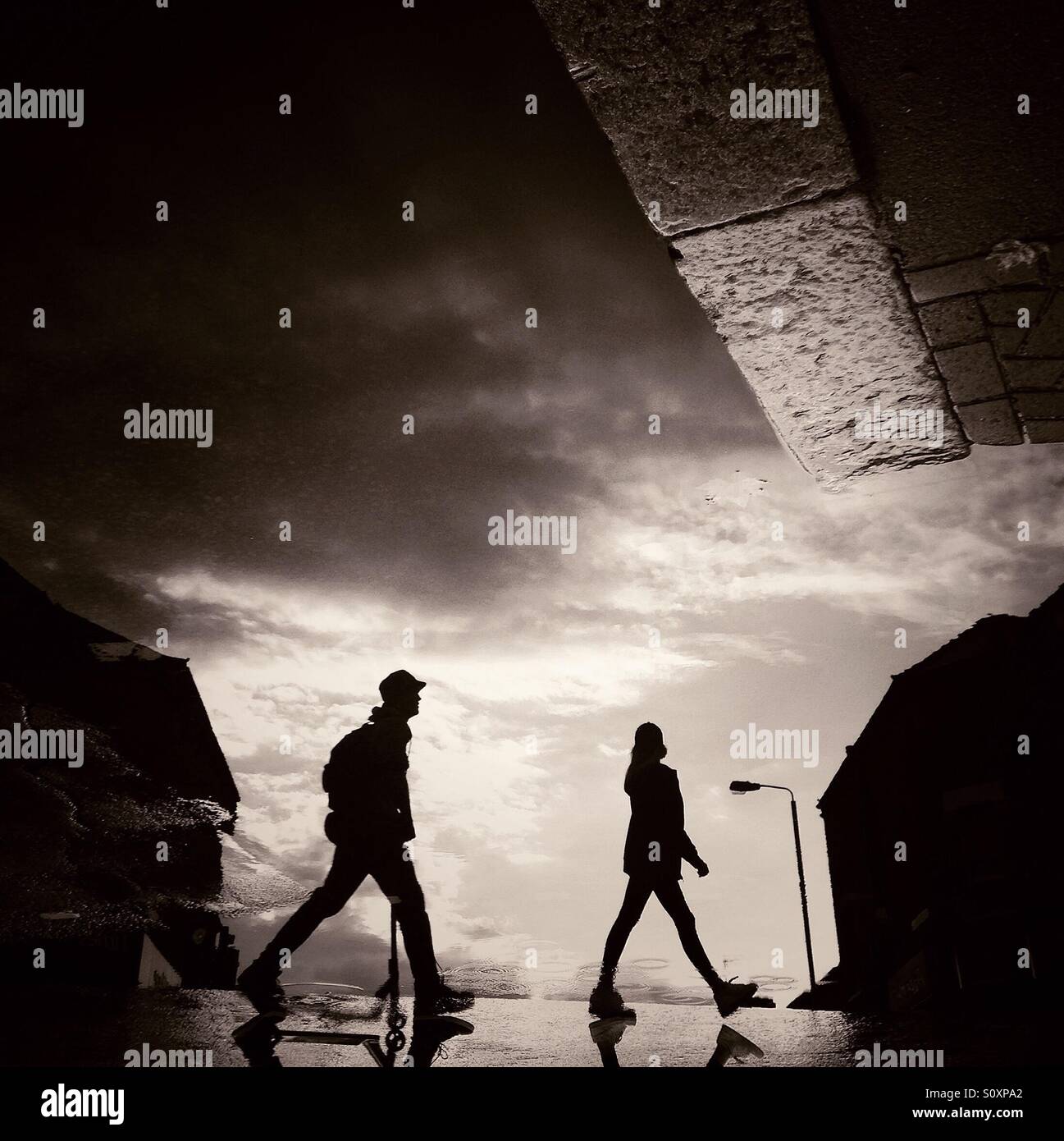 Two people crossing road silhouette silhouette Stock Photo Alamy