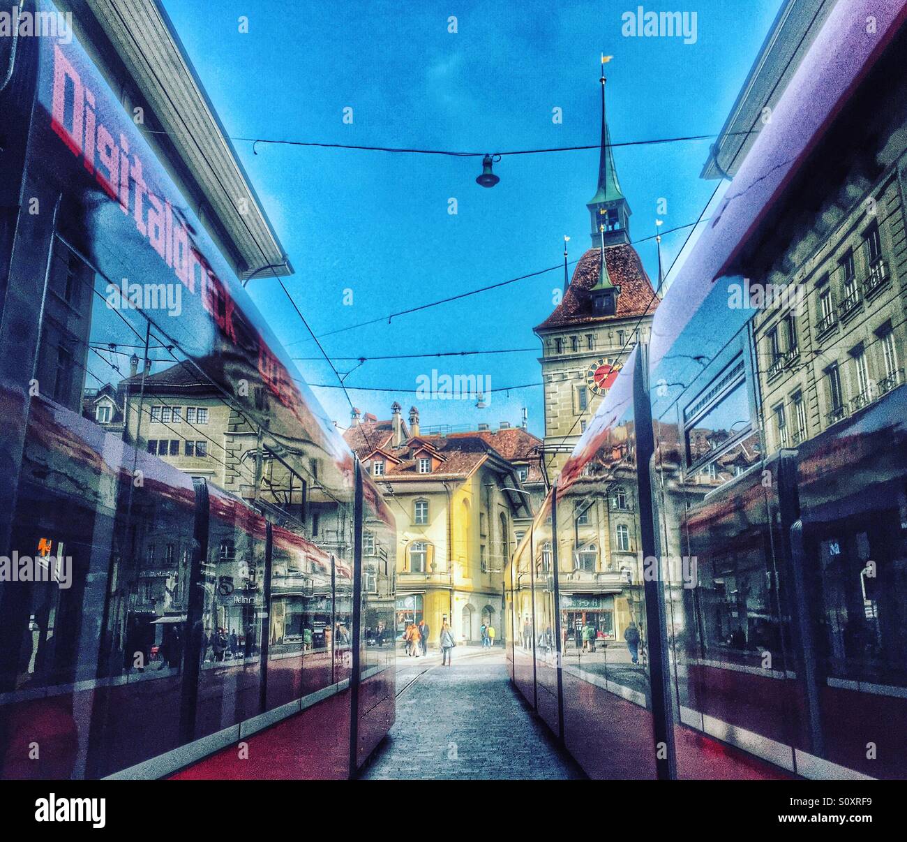 Two trams pass in the centre of Bern, Switzerland - Smartphone Captured Stock Image