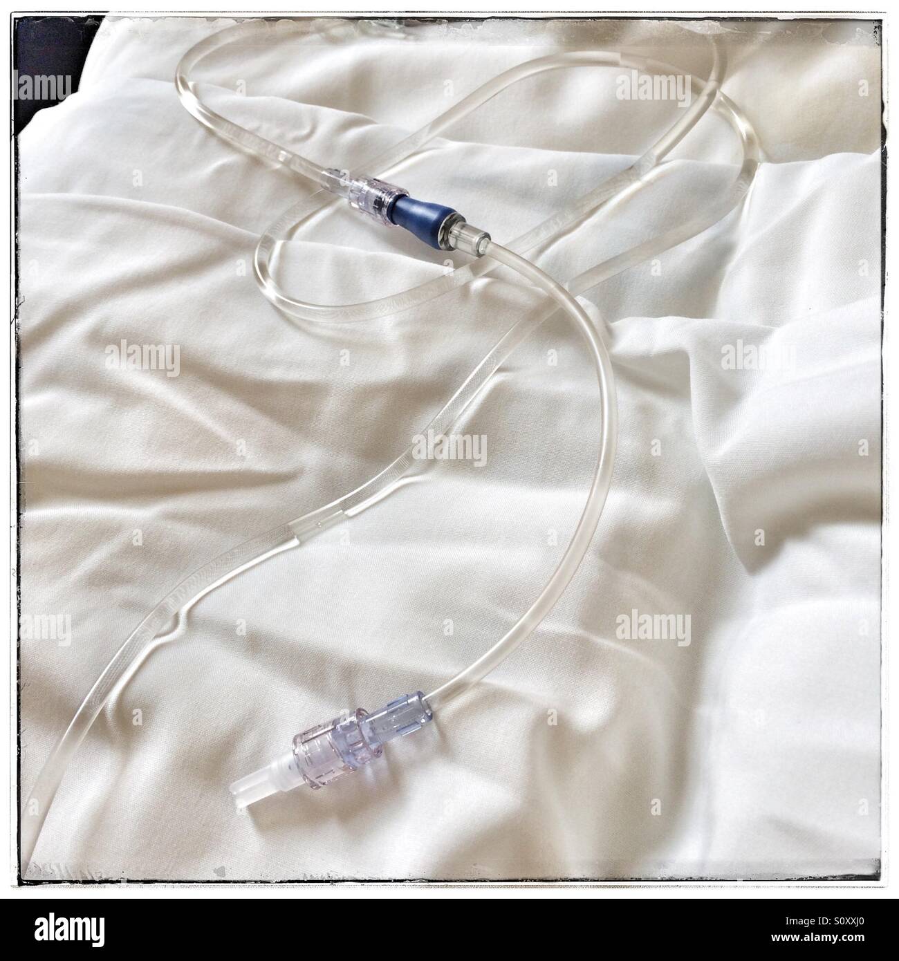 Materials used to put up drip for patient lying on hospital bed 