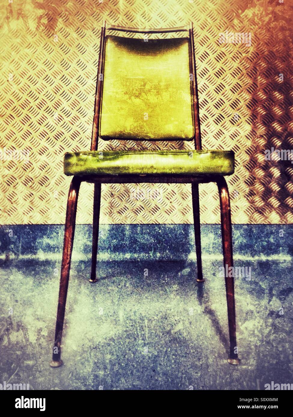 Chair against a wall Stock Photo Alamy