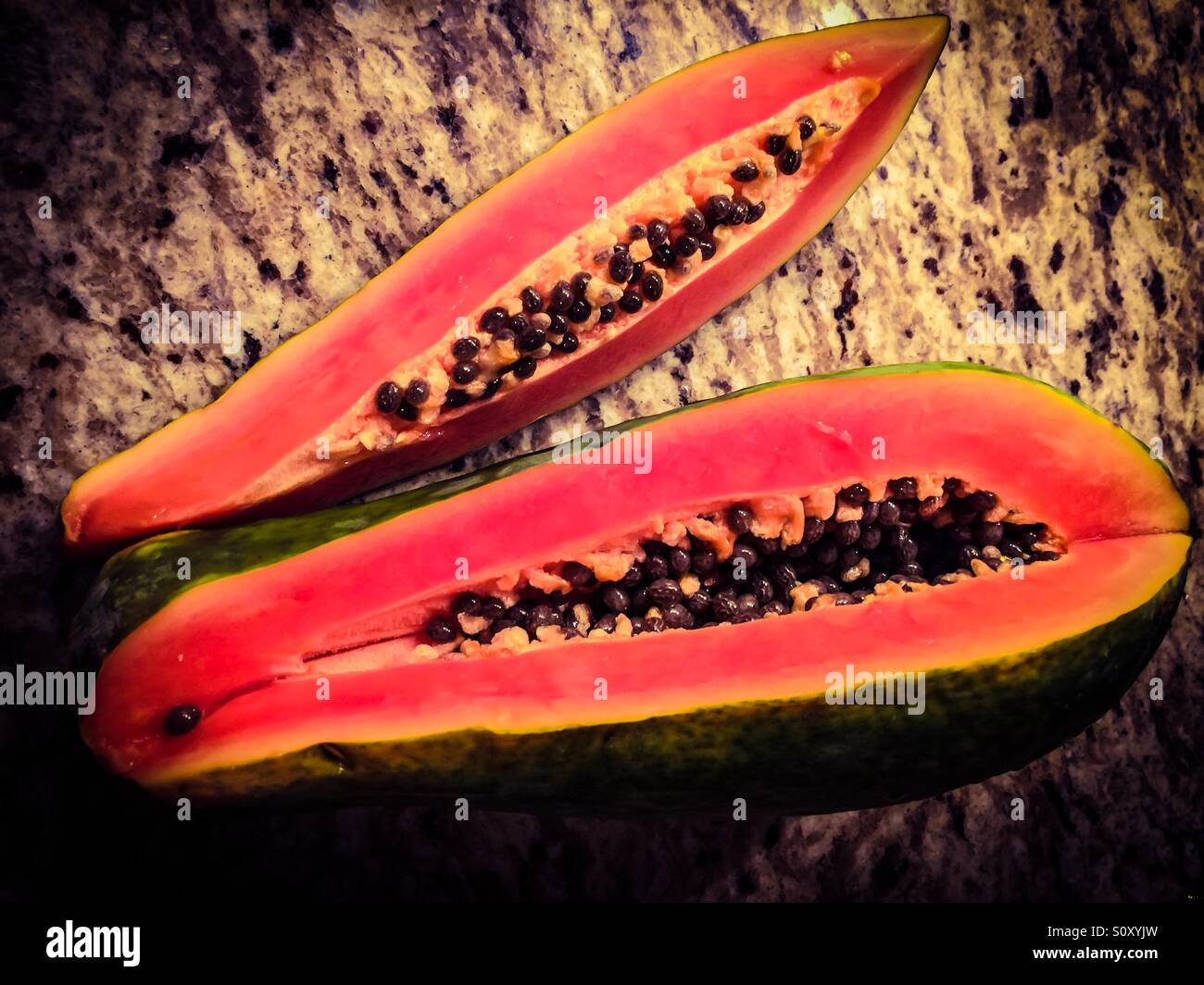 Fresh papaya on a granite slab - Smartphone Captured Stock Image