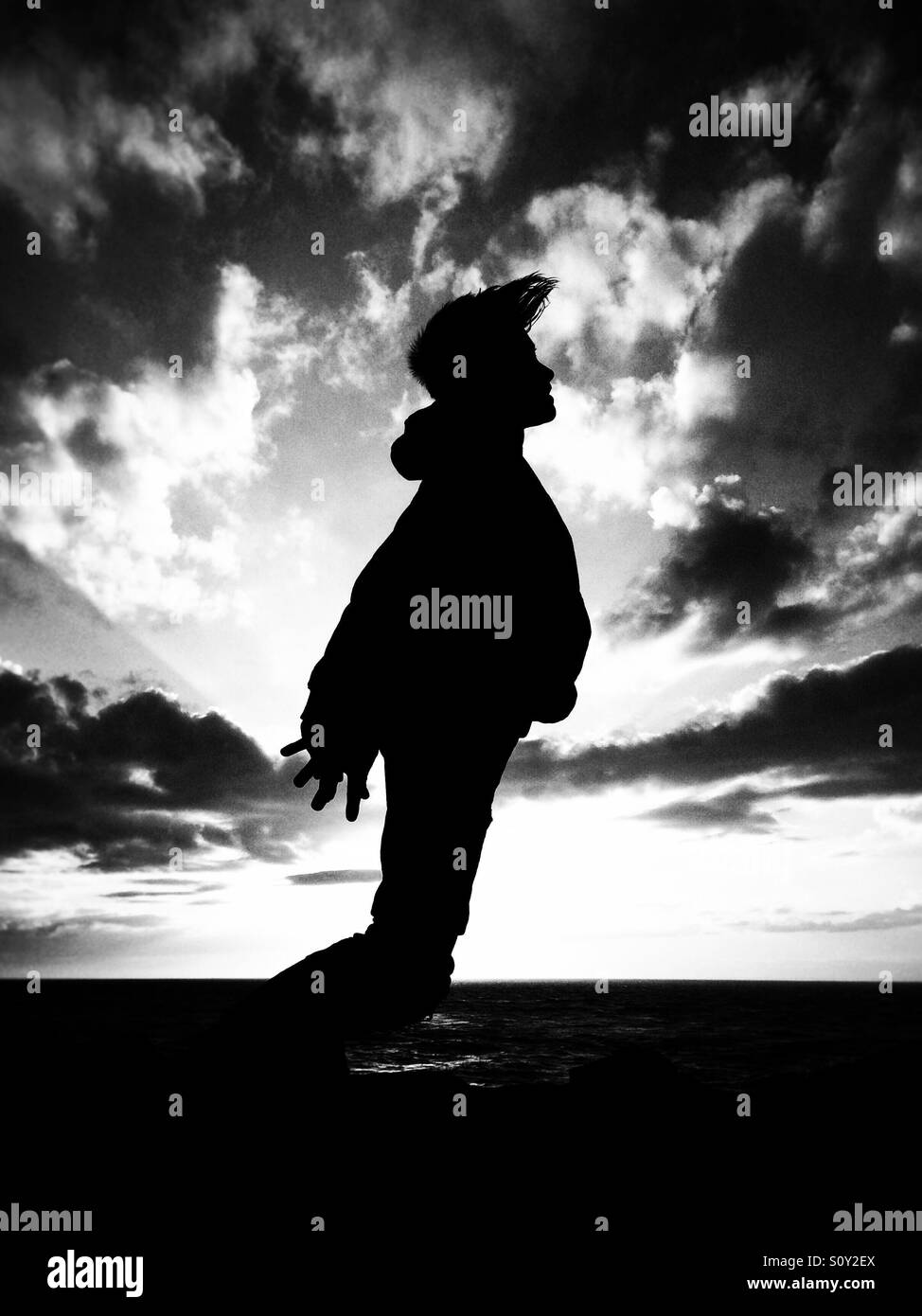 Child standing silhouette hi-res stock photography and images - Alamy