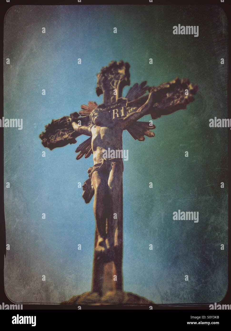Stone sculpture of Jesus Christ crucified on the cross - Smartphone Captured Stock Image