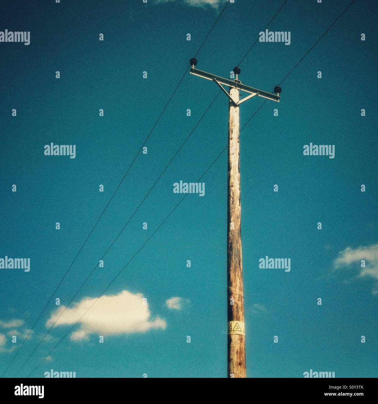 Overhead power line with grain effect added. - Smartphone Captured Stock Image