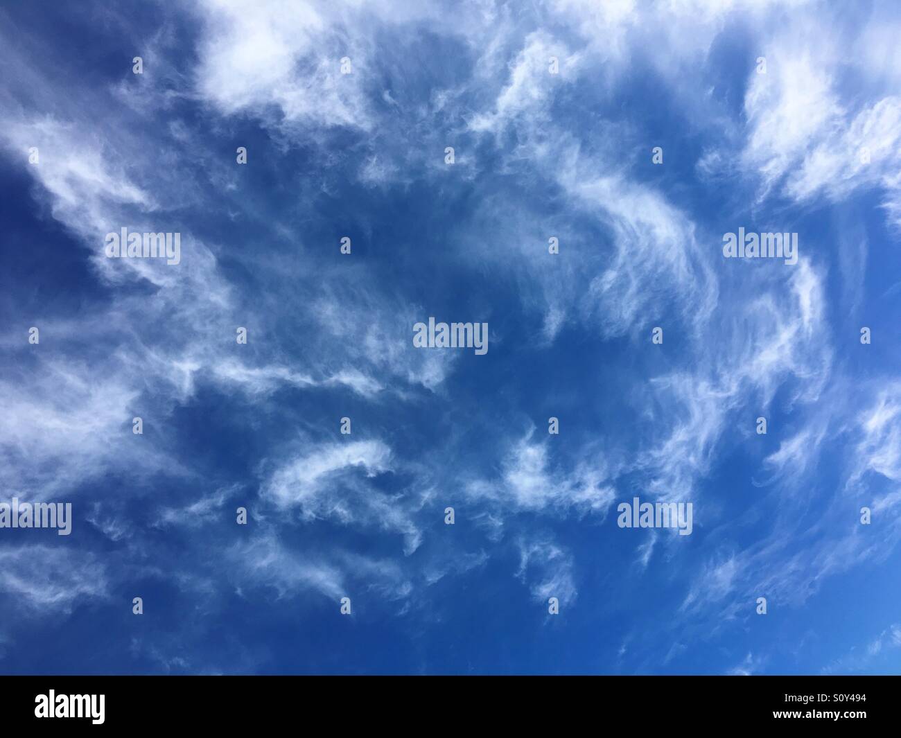 Wispy cirrus clouds Stock Photo