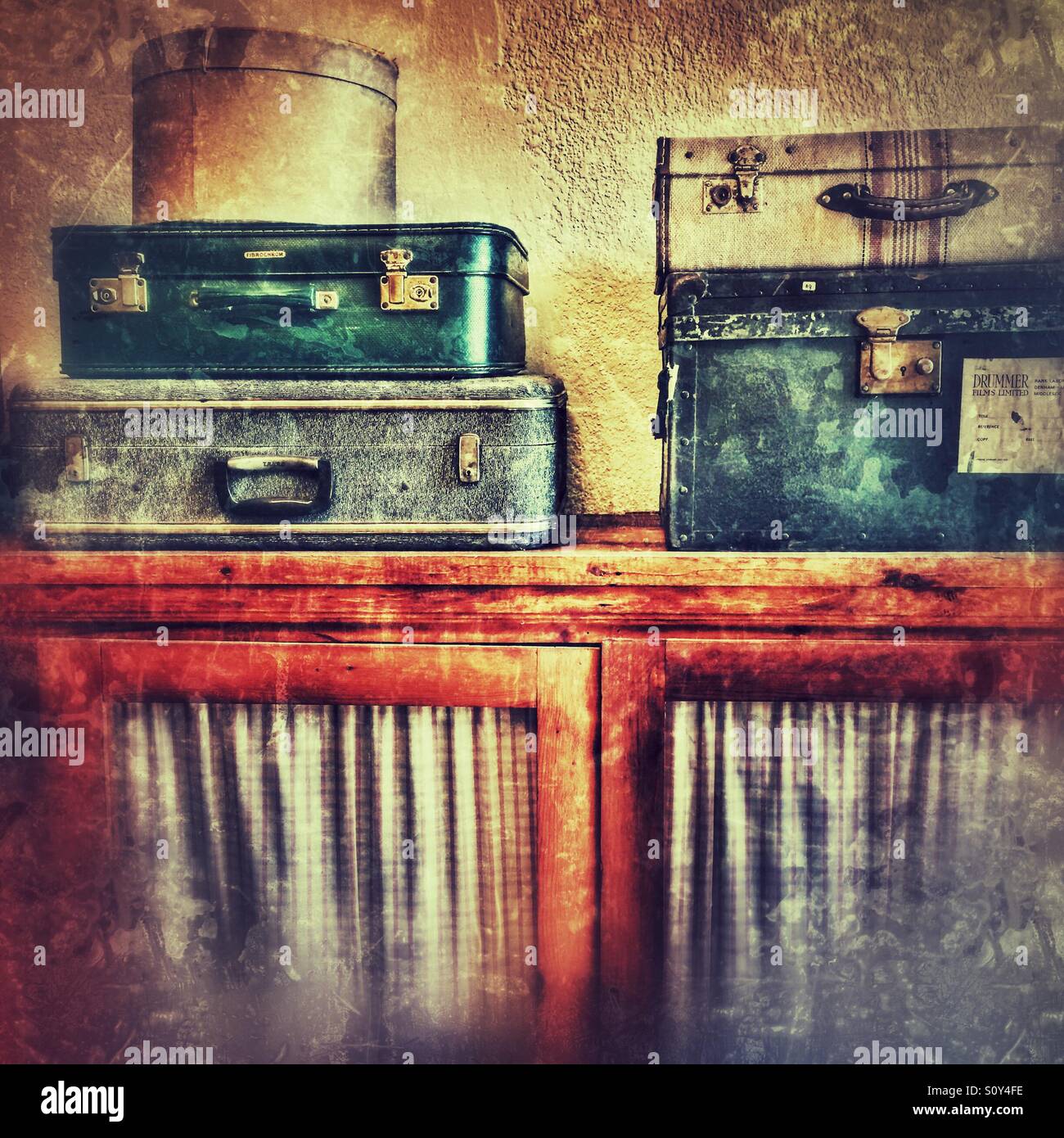 Suitcases and a hat box on a cupboard - Smartphone Captured Stock Image