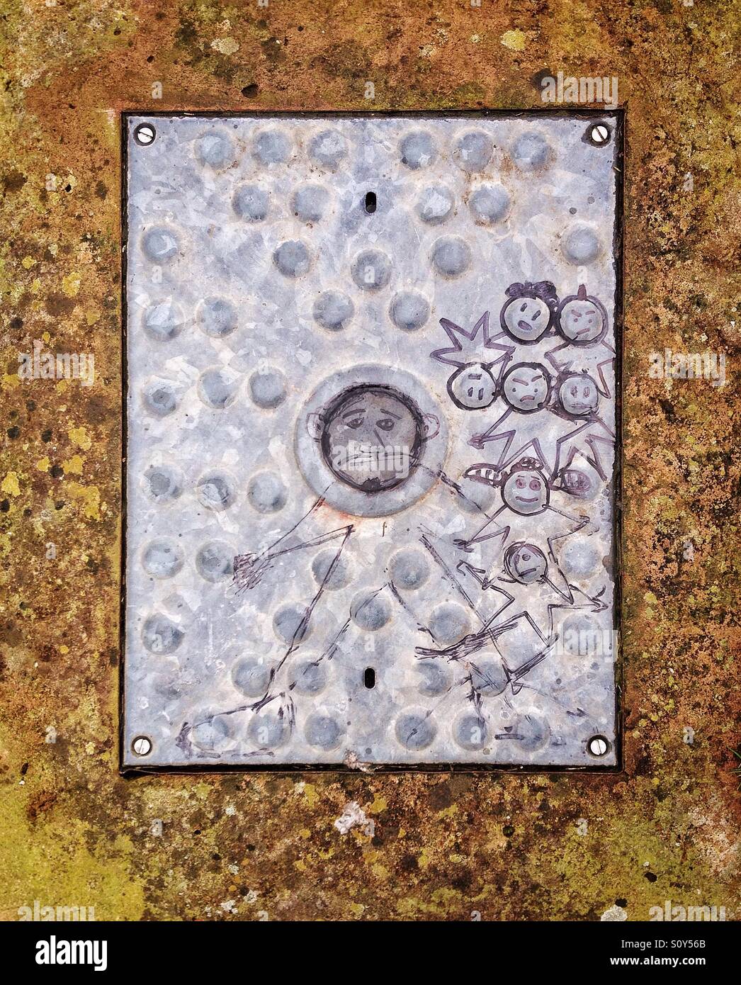 Childish art on manhole cover - Smartphone Captured Stock Image