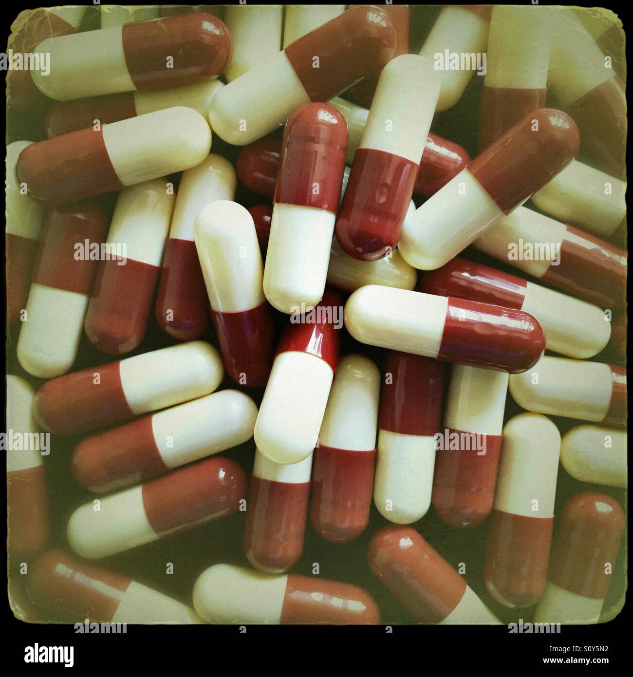 Red and white medicine capsules - Smartphone Captured Stock Image