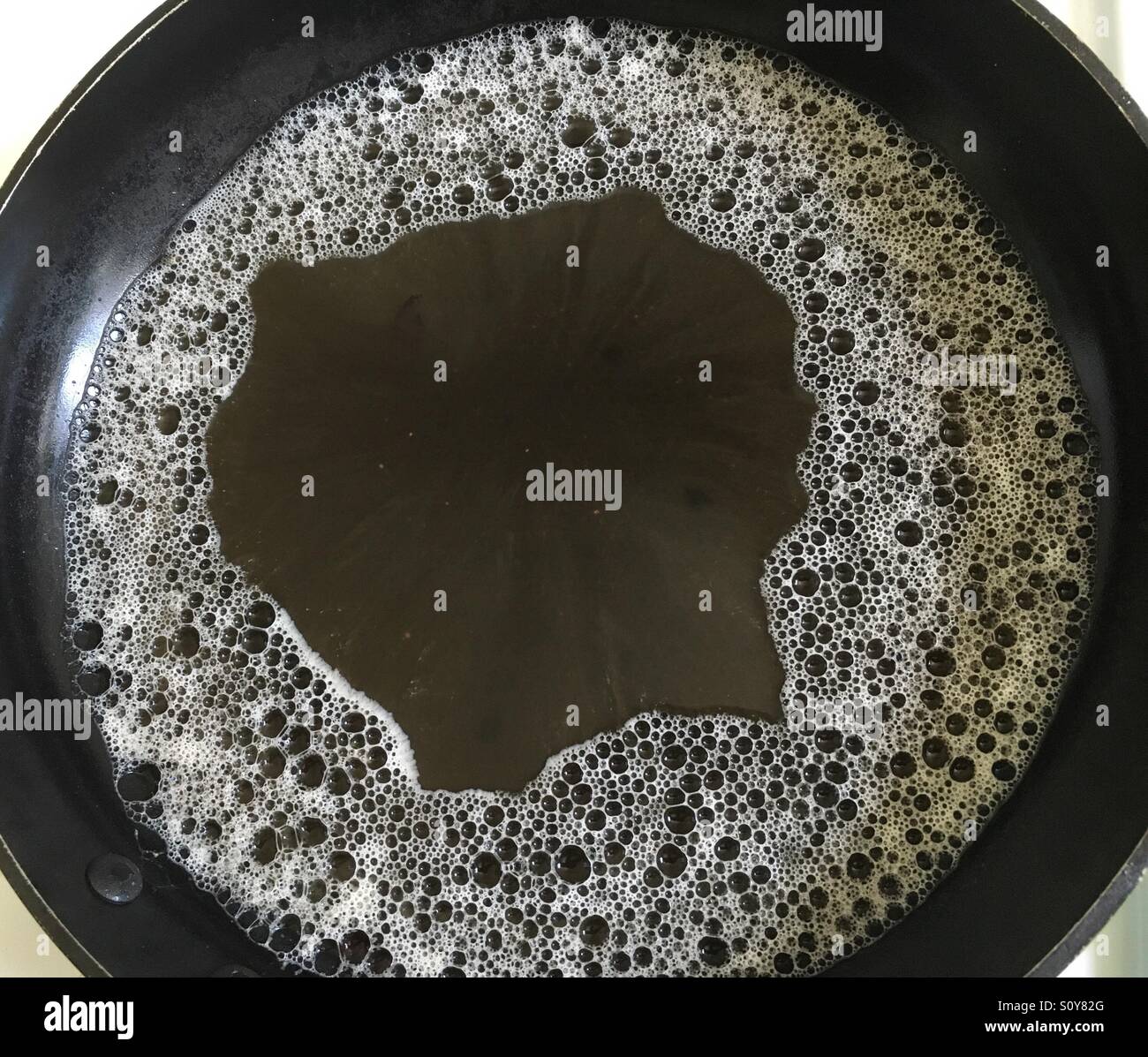 Greasy pan with soap bubbles Stock Photo Alamy