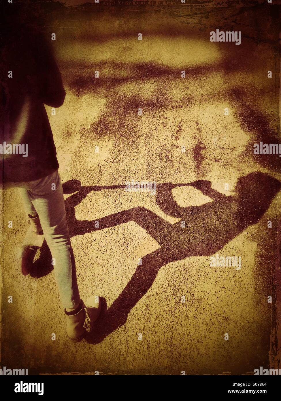 Shadow of girl on scooter - Smartphone Captured Stock Image