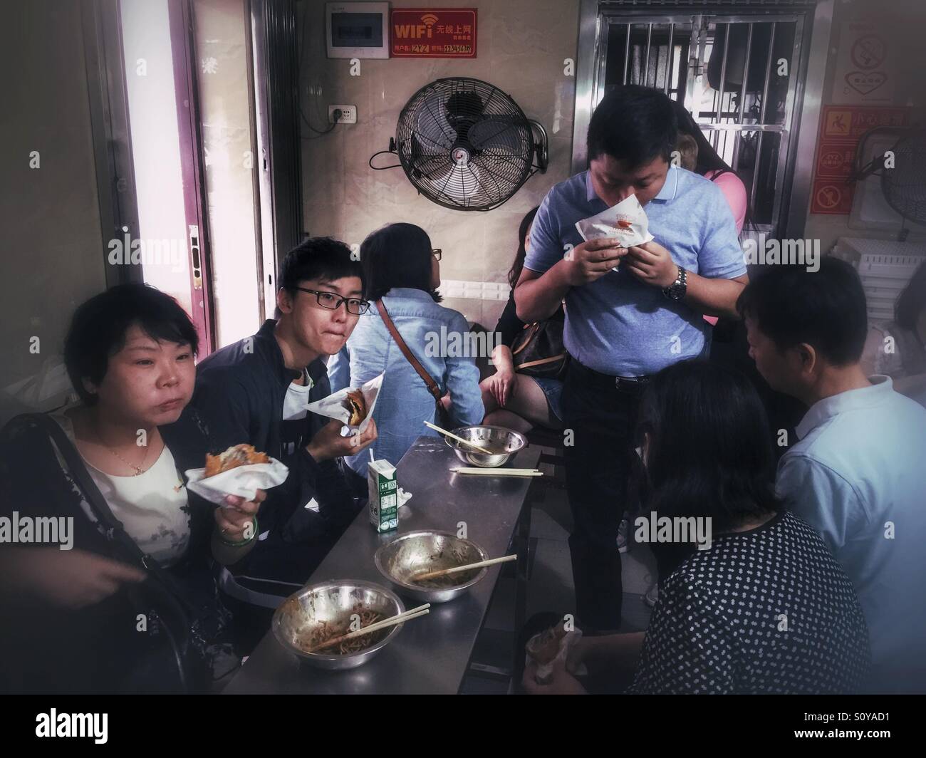 Chinese taking breakfast - Smartphone Captured Stock Image