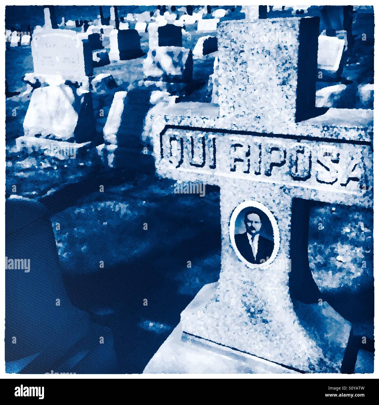 A tombstone in an old cemetery that says 'qui riposa' ('here lies') in Italian, with an image of the man buried there - Smartphone Captured Stock Image