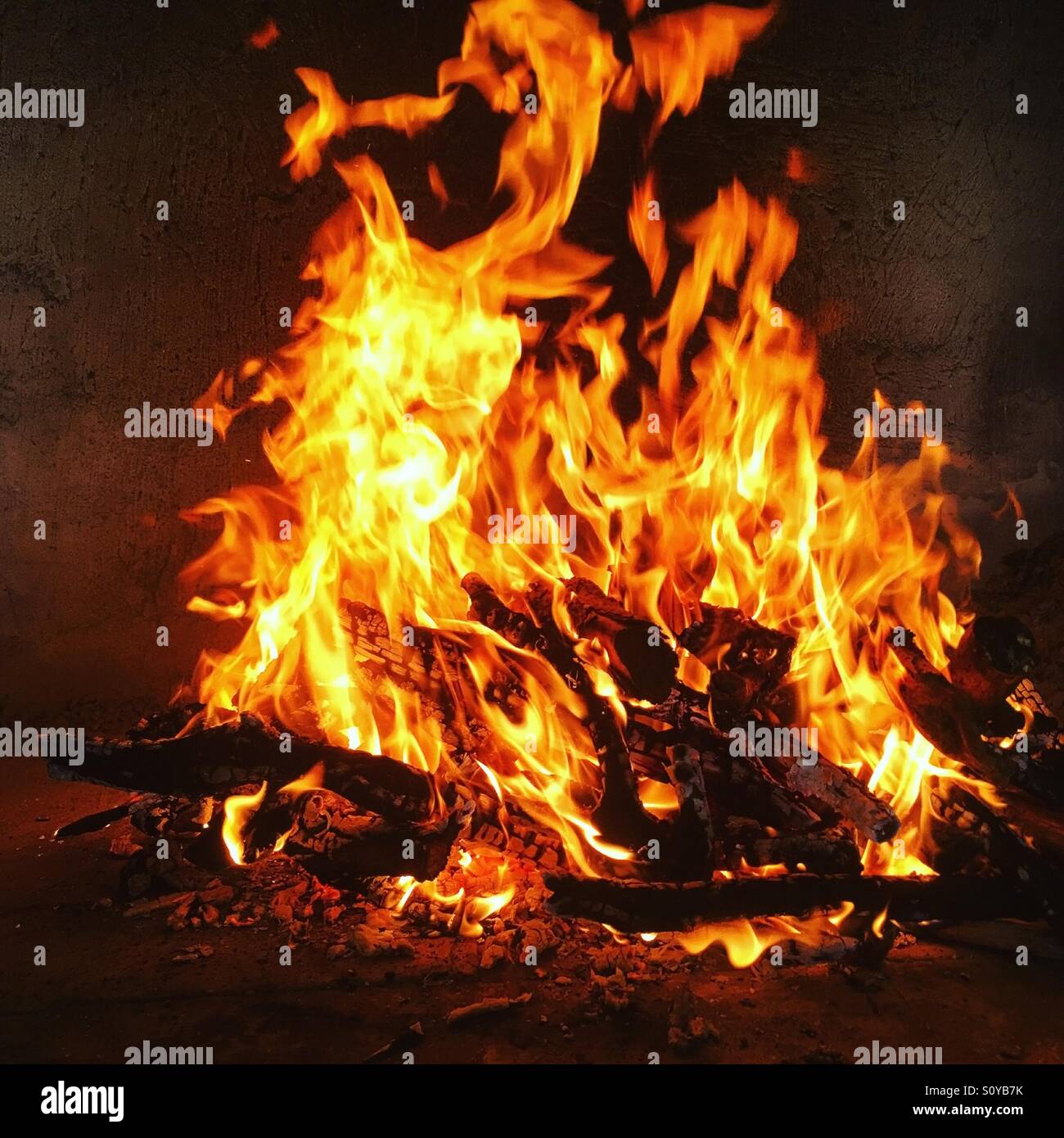 Fire burning in fireplace Stock Photo