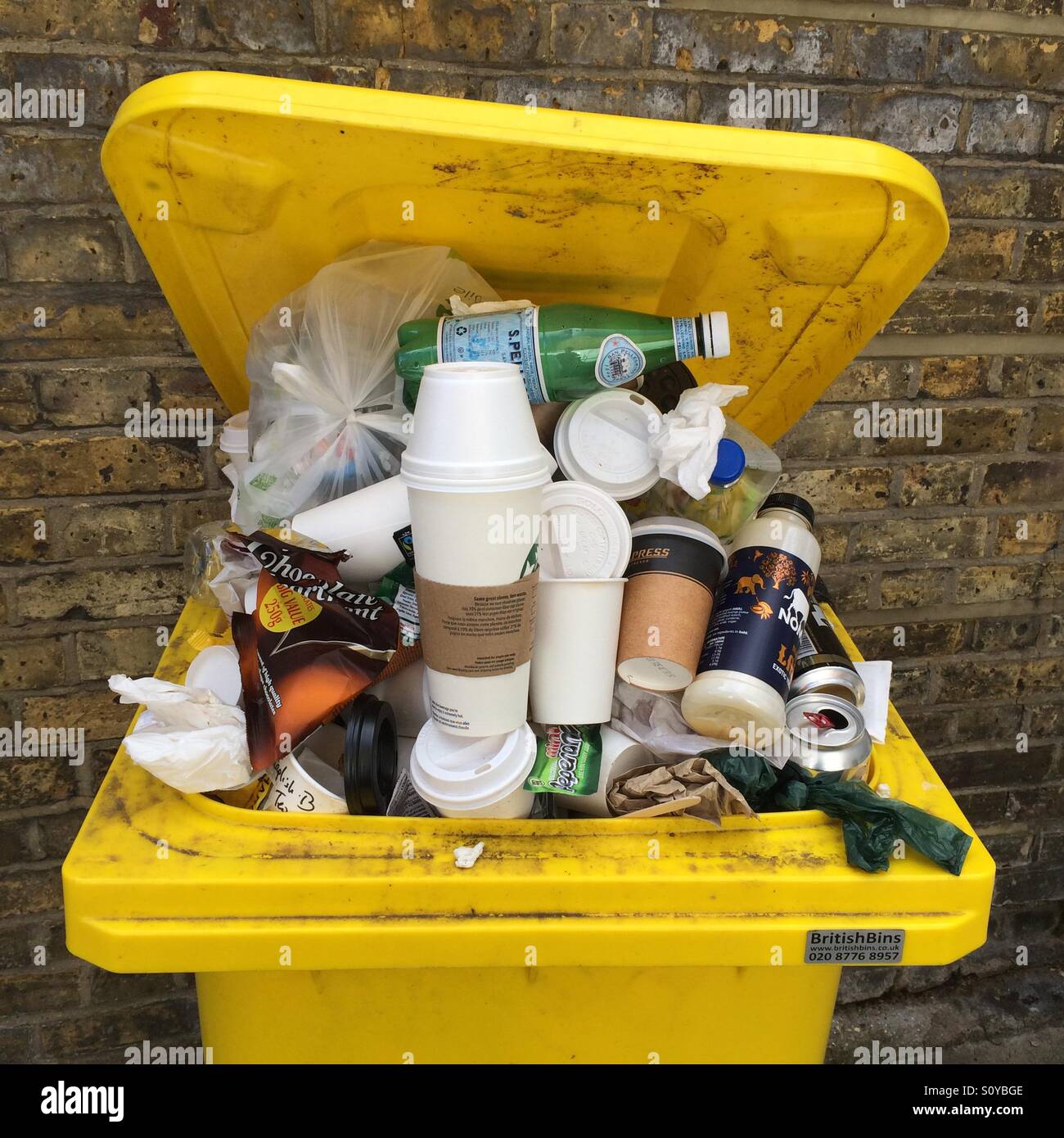 An overflowing rubbish bin - Smartphone Captured Stock Image