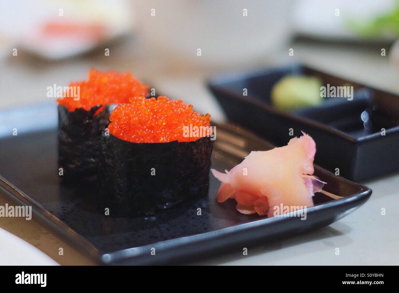 Flying fish roe sushi Stock Photo - Alamy