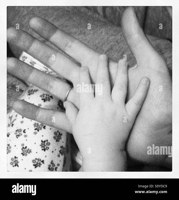 Mummy and baby hands Stock Photo