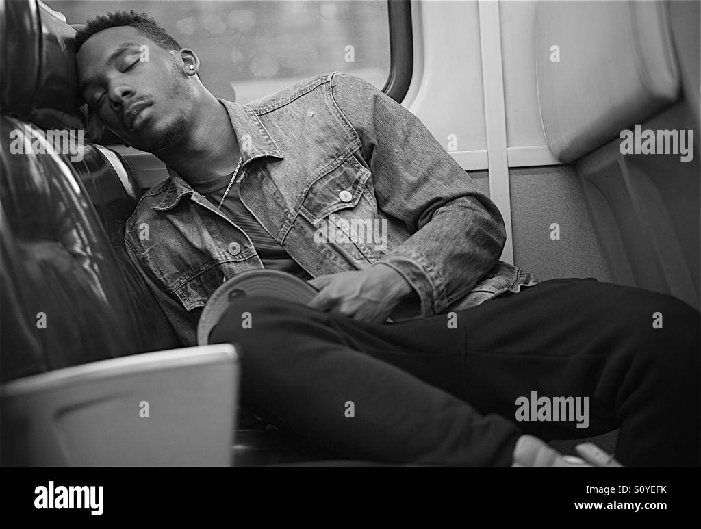 Young man falls asleep with a book open Stock Photo Alamy