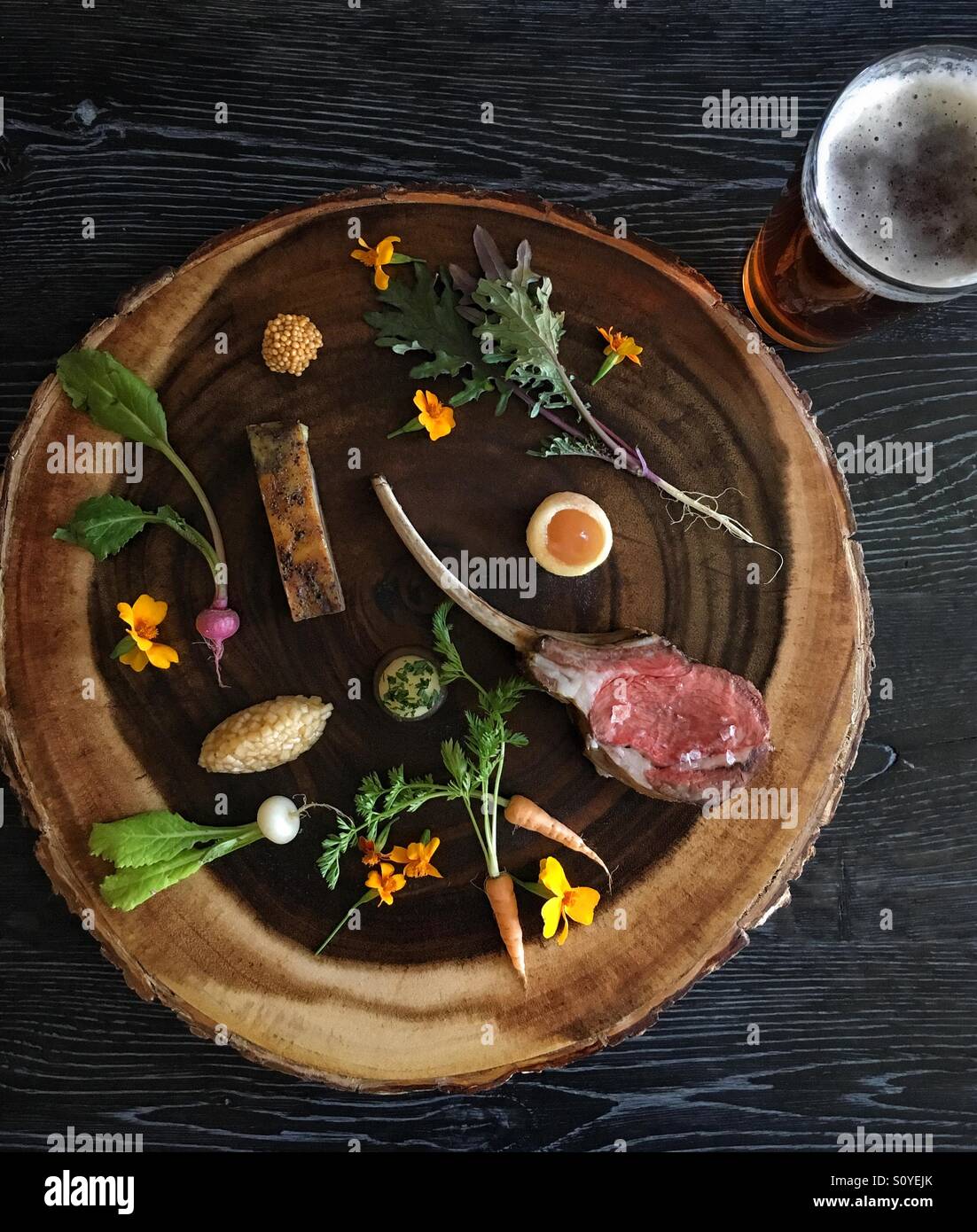 Lamb chop with local foraged vegetables, L'Auberge Provencale Restaurant in Virginia, USA - Smartphone Captured Stock Image