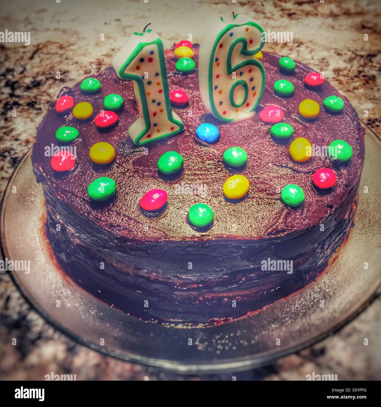 Sixteenth Birthday cake. Home made chocolate cake with colourful ...
